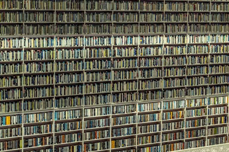 Expansive shelves filled with books in a Dubai library, showcasing an organized collection.