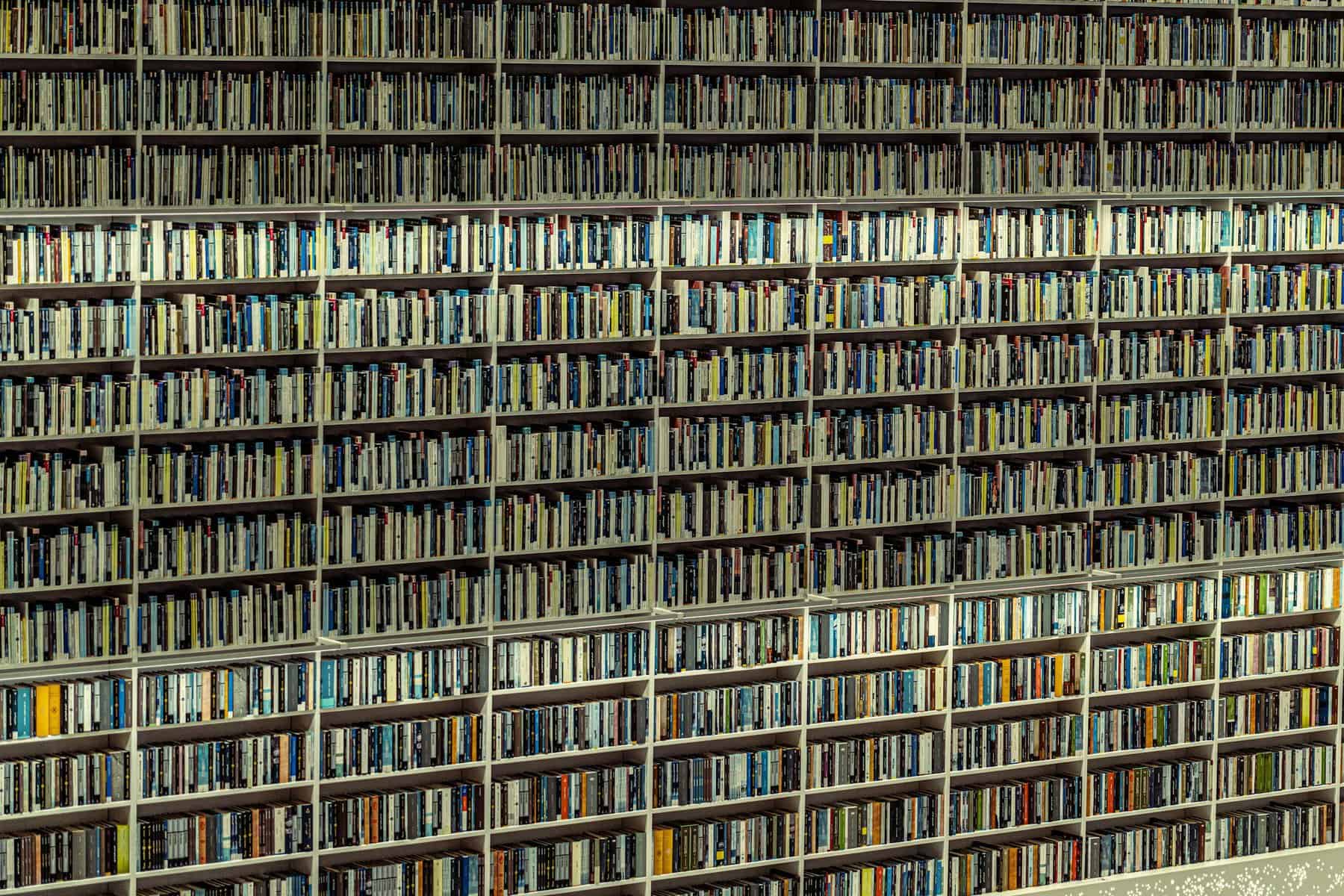 Expansive shelves filled with books in a Dubai library, showcasing an organized collection.